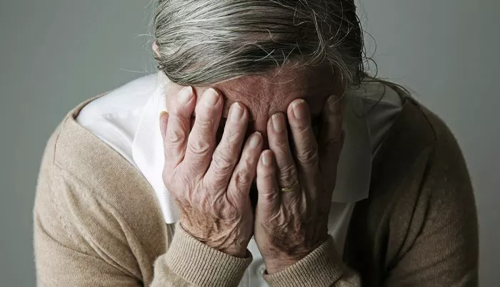 1140-alzheimer-myths-woman-hiding-face-esp.imgcache.rev.web.700.403